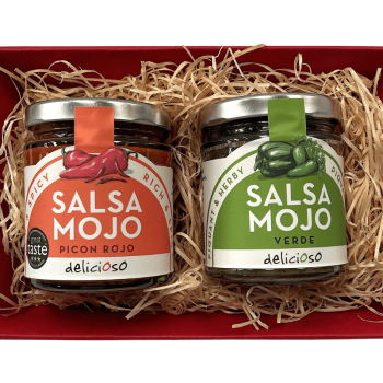 Two jars of salsa from the Canary Islands: Mojo Picon Rojo and Mojo Verde, shown together in a red gift tray with wood wool